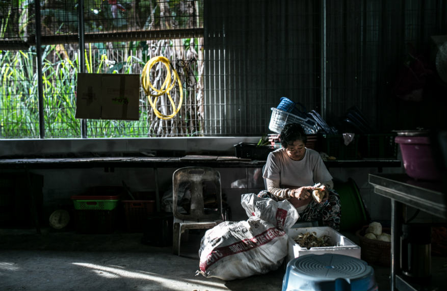 A diner enjoying his chicken rice meal at the shop.